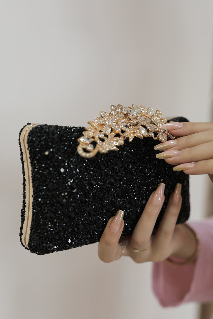 Schwarze Eleganz mit Goldakzenten Tasche